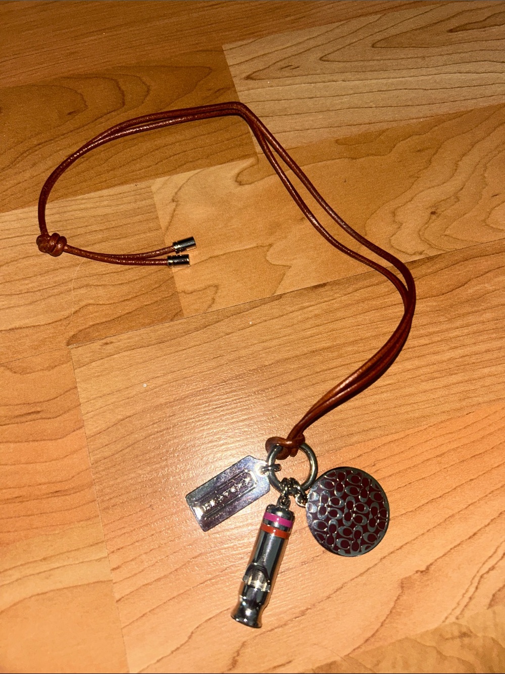 Coach Brown Leather Charm Necklace with Silver and Pink Accents